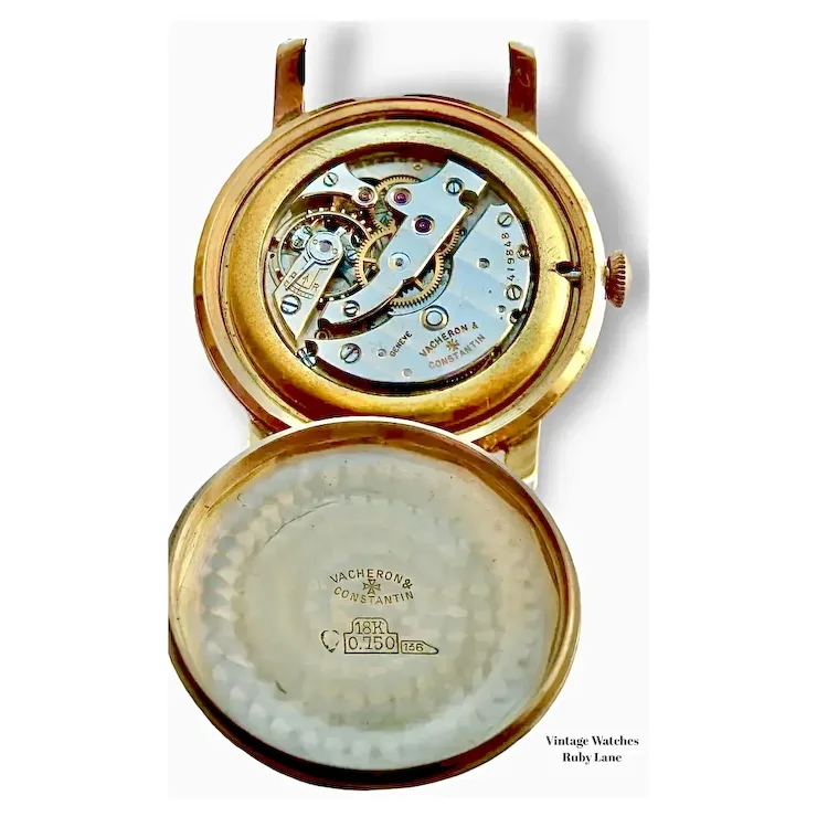 Gold Vacheron Constantin watch with open face on a white background