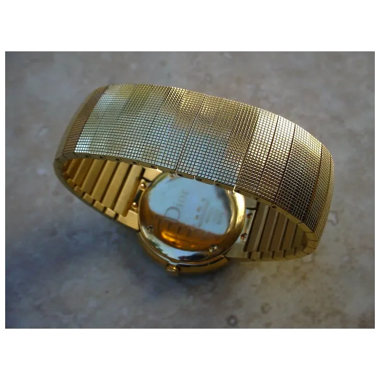 Gold mesh bracelet on a textured surface