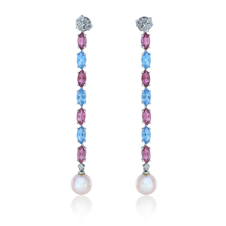 Pair of earrings with pink and blue gemstones on a white background