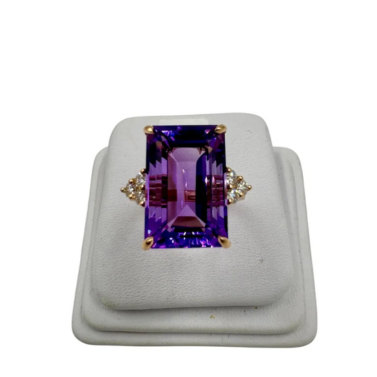 Purple gemstone ring on a white background