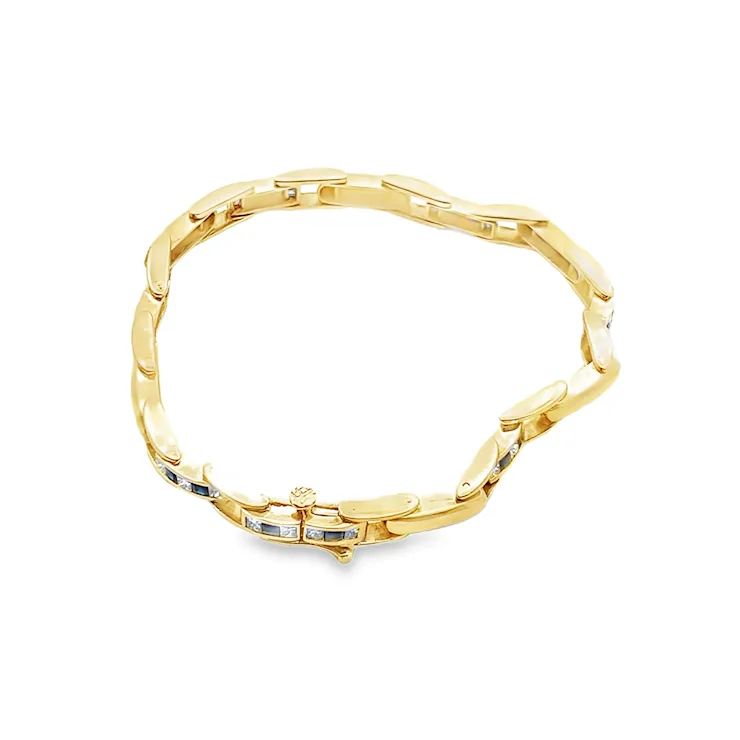 Gold bracelet with a white background