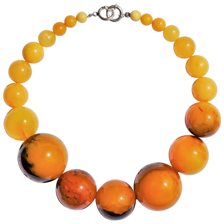 Necklace with orange and yellow beads on a white background