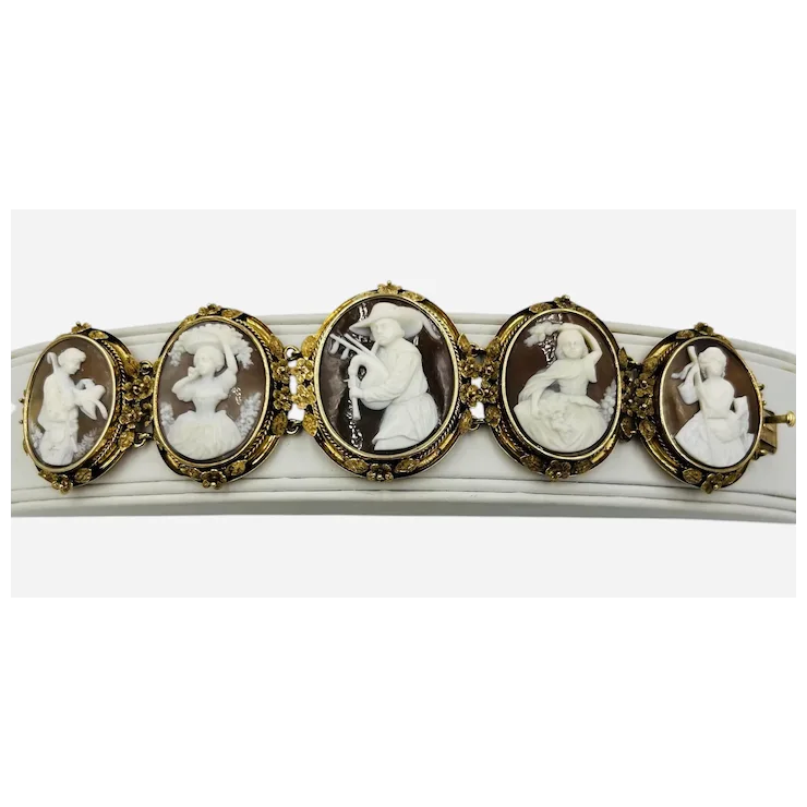 Bracelet with gold and cameo stones on a white background