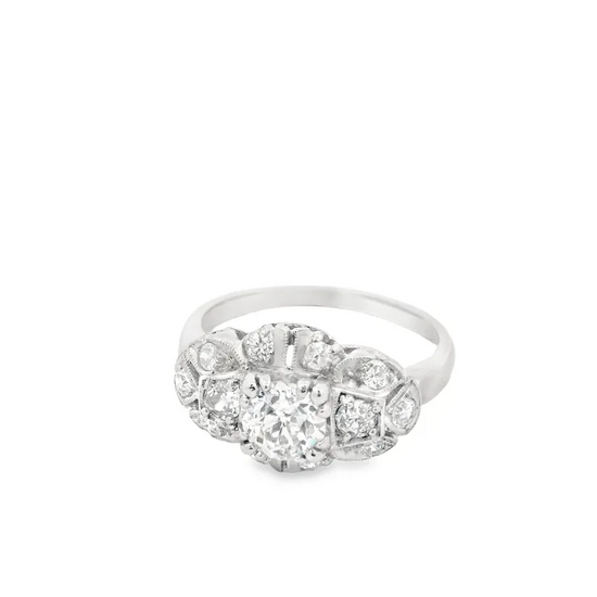 Silver ring with diamond accents on a white background
