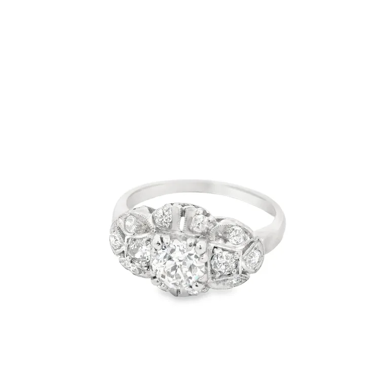 Silver ring with diamond accents on a white background