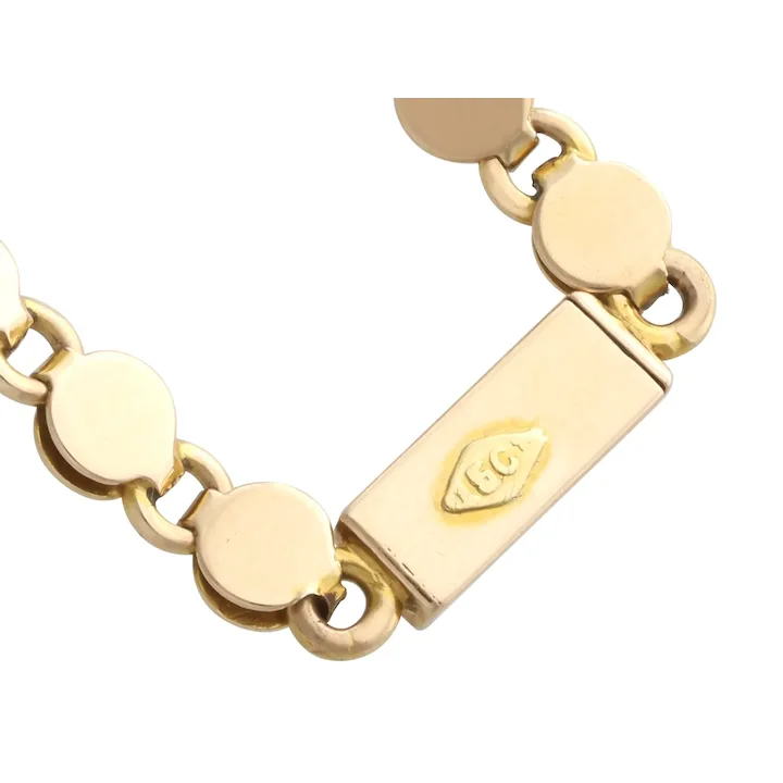 Gold bracelet with a clasp on a white background