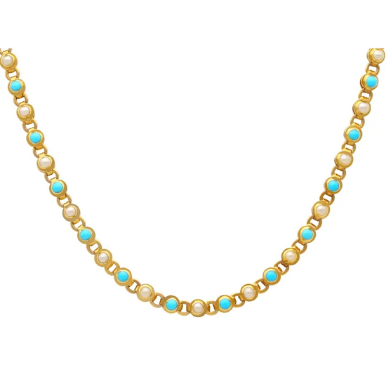Necklace with pearls and turquoise stones on a white background