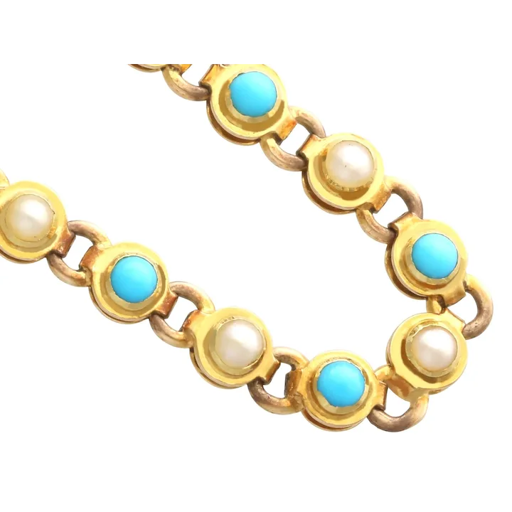 Gold bracelet with turquoise and pearl stones on a white background