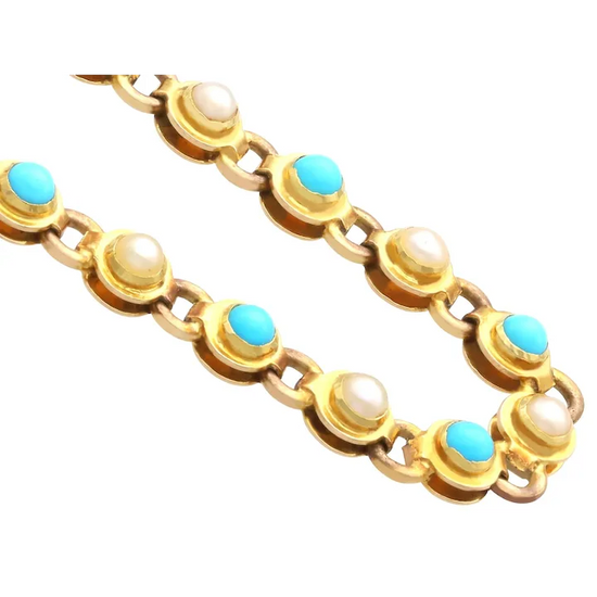 Gold bracelet with turquoise and pearl stones on a white background