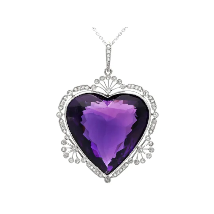 Heart-shaped purple gemstone pendant on a white background