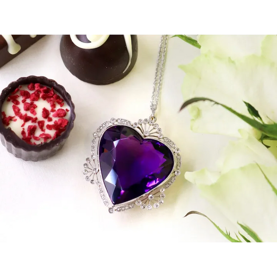 Heart-shaped purple pendant on a chain with a floral background