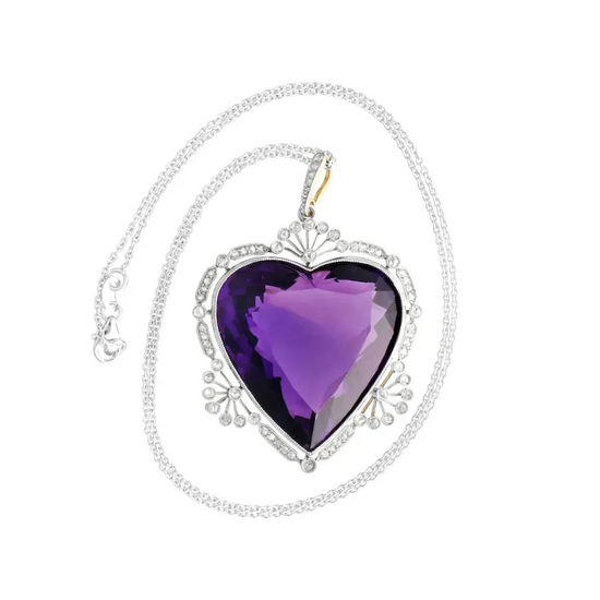 Heart-shaped purple pendant on a silver chain against a white background