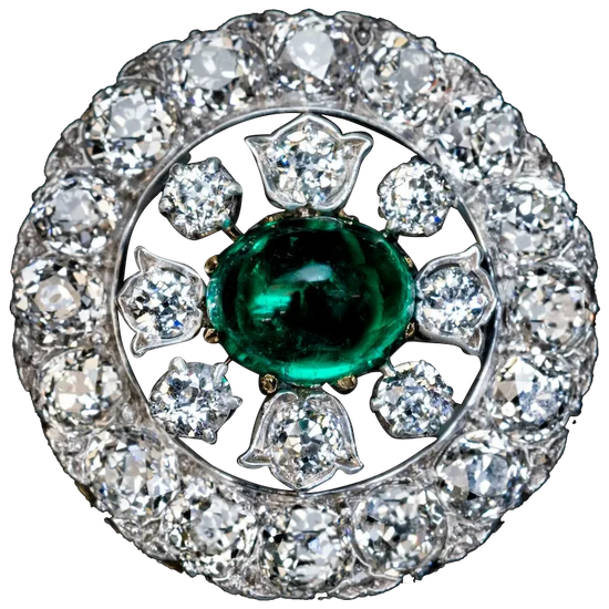 Diamond ring with a central emerald stone on a white background