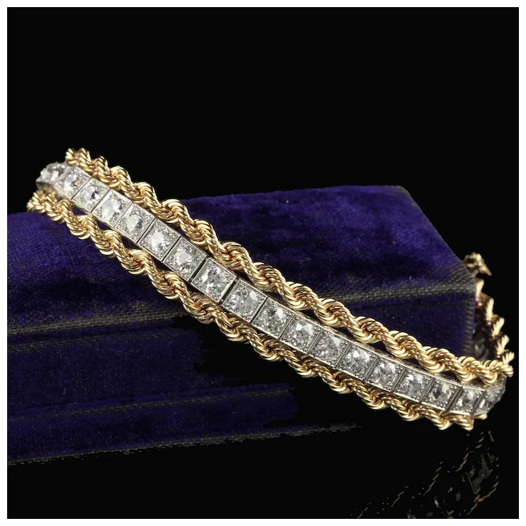 Gold and diamond bracelet on a dark background
