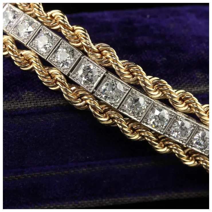 Gold bracelet with diamond stones on a dark blue background