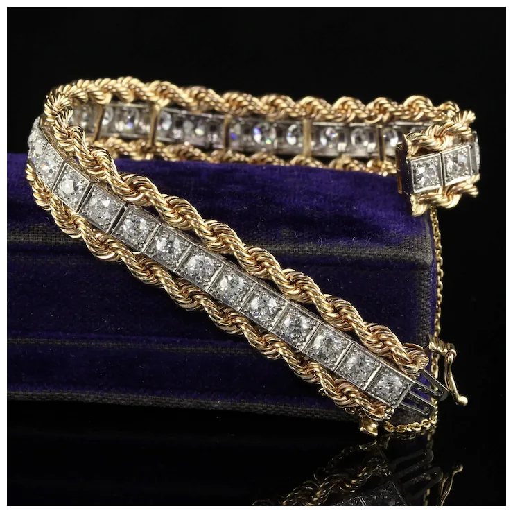 Gold bracelet with diamond accents on a dark background