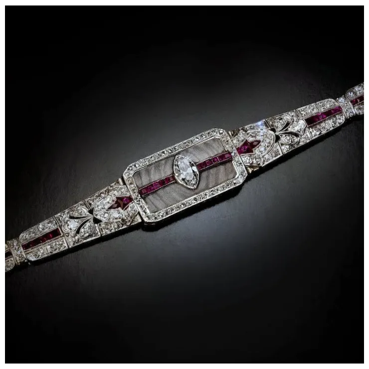 Elegant diamond and ruby bracelet on a dark background