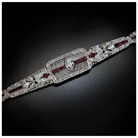 Elegant diamond and ruby bracelet on a dark background
