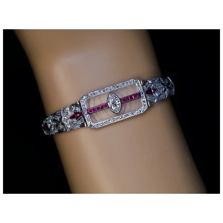 Elegant bracelet with gemstones on a mannequin arm against a black background