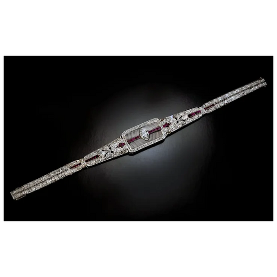 Diamond bracelet with red stones on a black background