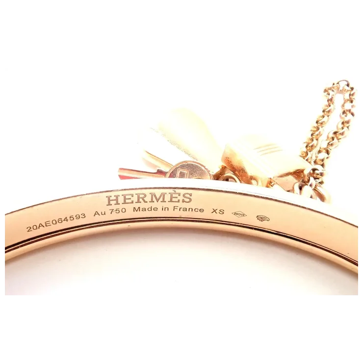Rose gold Hermès bracelet on a white background