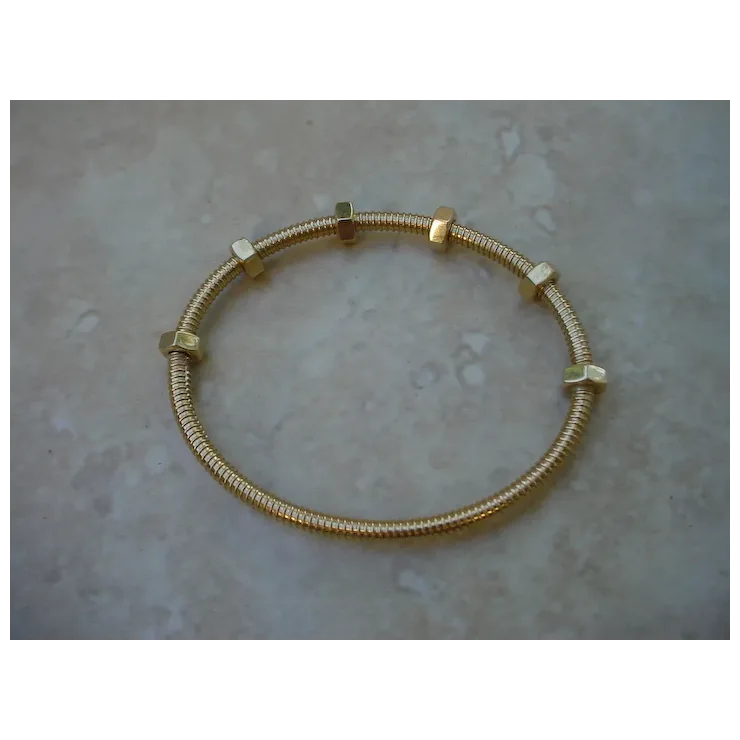 Gold bracelet on a textured surface