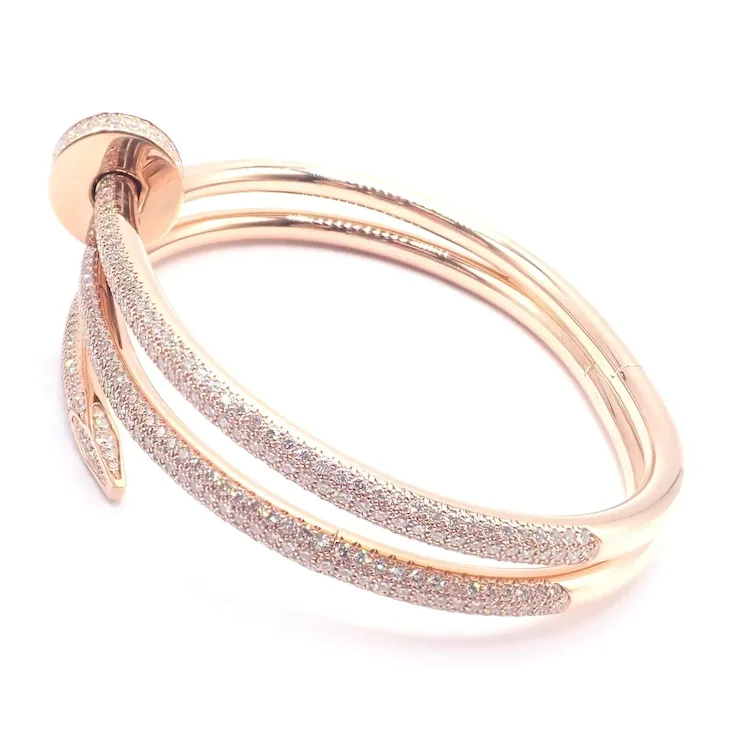 Rose gold bracelet with glittery accents on a white background