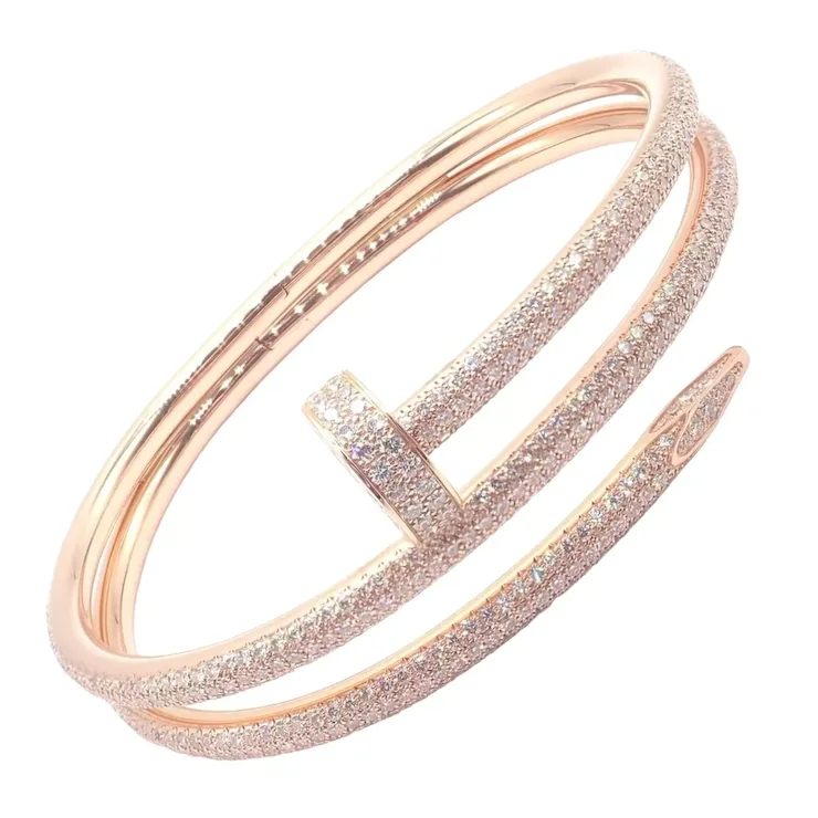 Rose gold bracelet with glittery finish on a white background