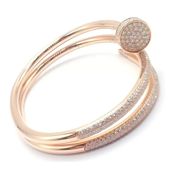 Rose gold bracelet with glittery finish on a white background