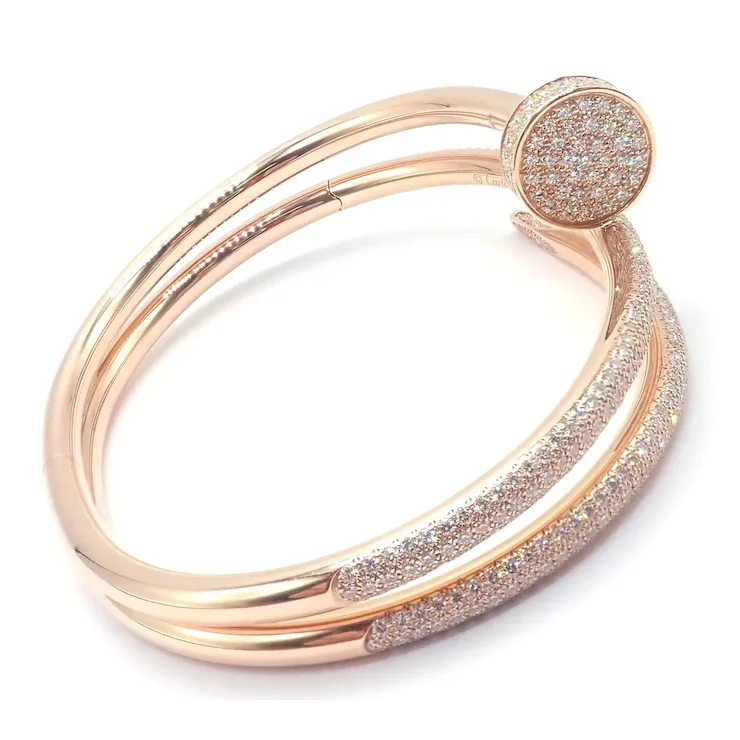 Rose gold bracelet with glittery finish on a white background