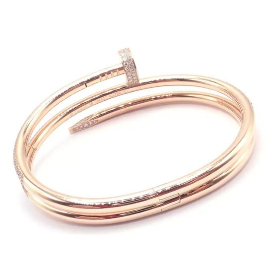 Rose gold bangles with clear stones on a white background