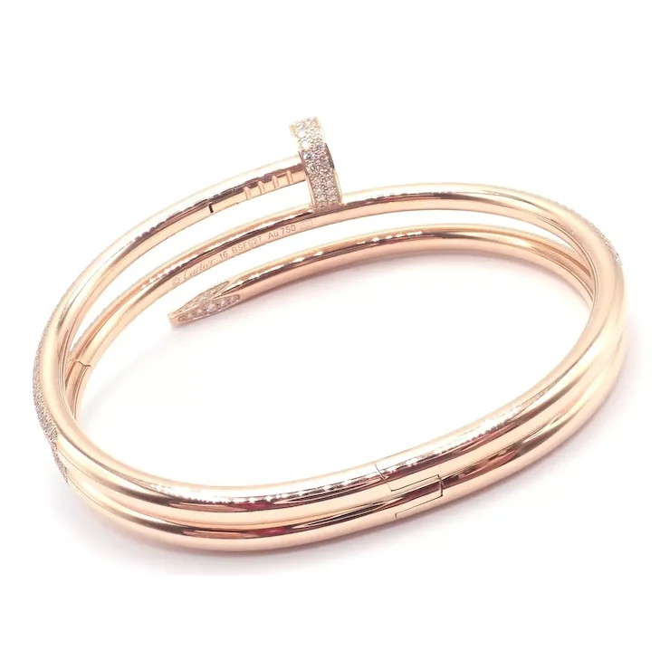 Rose gold bangles with clear stones on a white background