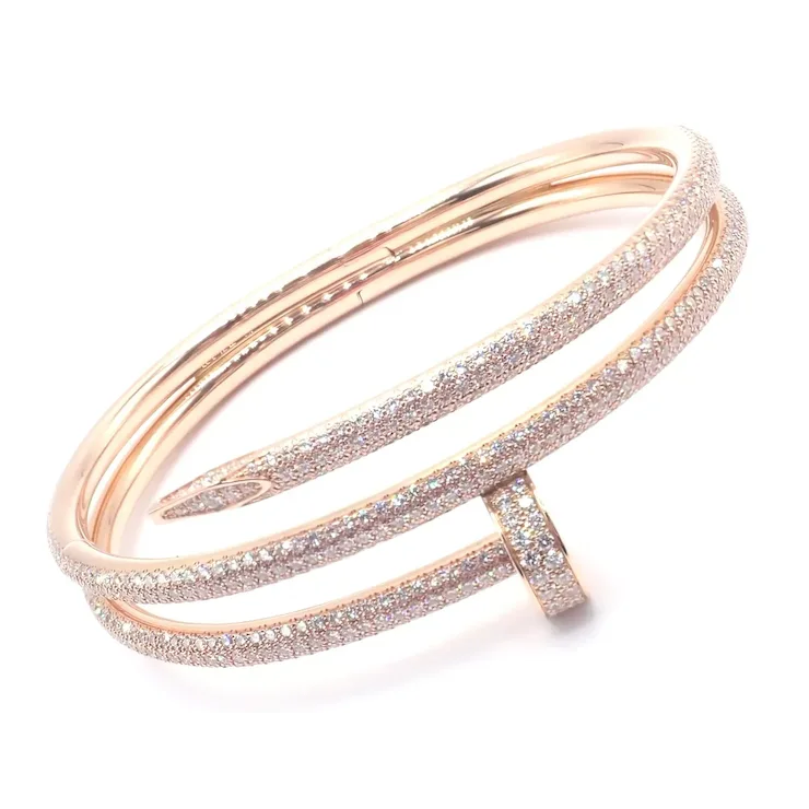 Rose gold bracelet with glittery accents on a white background