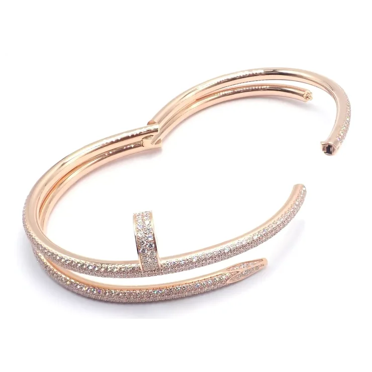 Rose gold bracelet with diamond accents on a white background