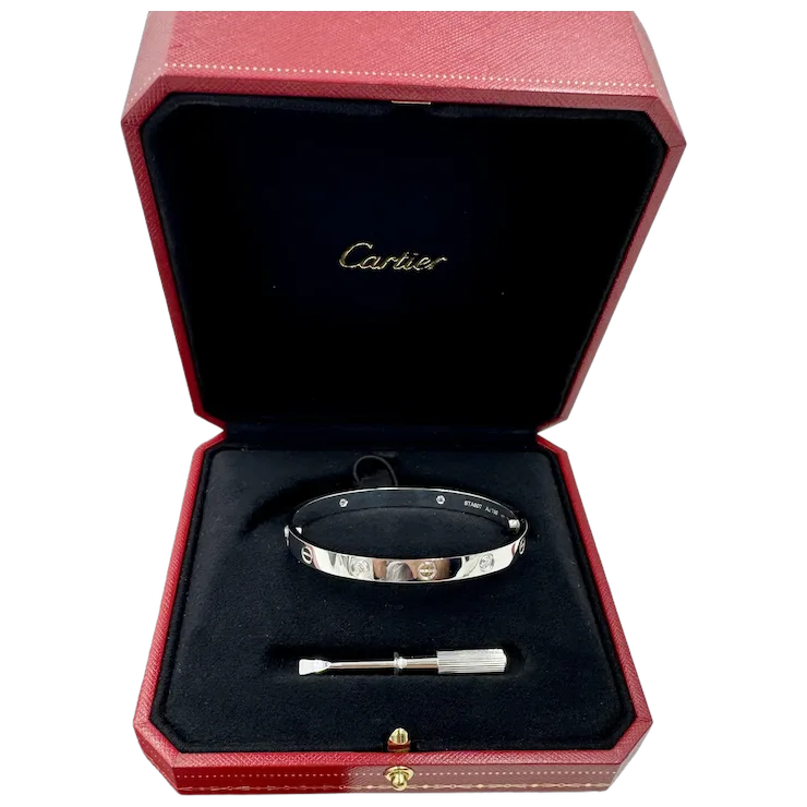 Cartier bracelet in a red box with a black interior