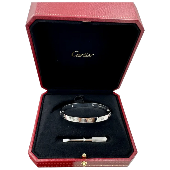 Cartier bracelet in a red box with a black interior