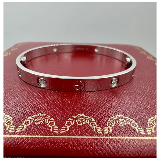 Silver bracelet with diamonds on a red leather box