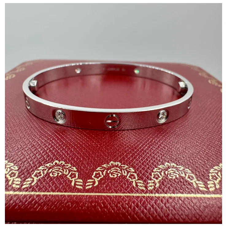 Silver bracelet with diamonds on a red leather box