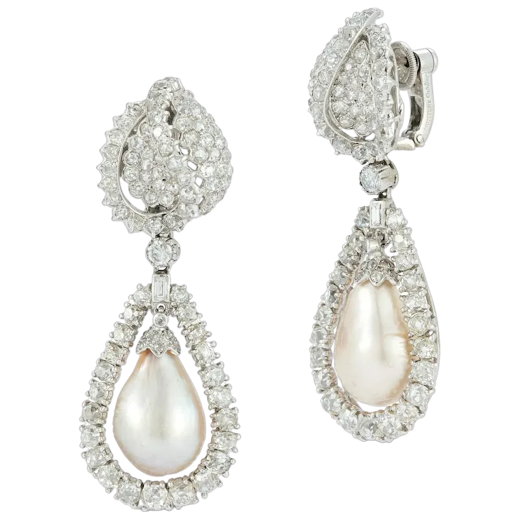 Teardrop-shaped earrings with pearls and diamonds on a white background