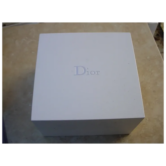 White Dior box on a beige surface