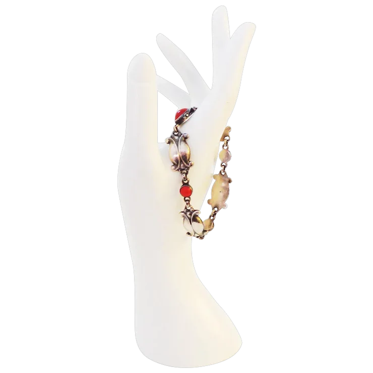 Bracelet with beads on a white deer antler stand