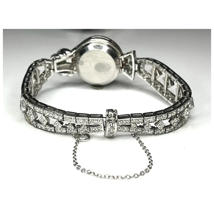 Silver bracelet with clear gemstones on a white background