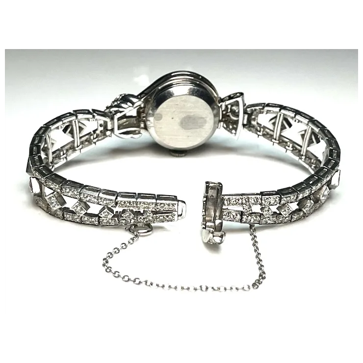 Silver bracelet with diamond-like stones on a white background