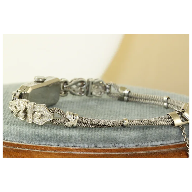Silver bracelet on a textured surface with a neutral background