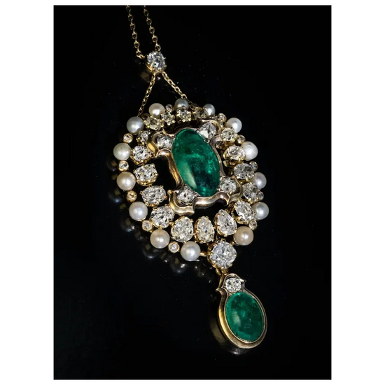 Ornate necklace with emerald and pearl pendant on a black background