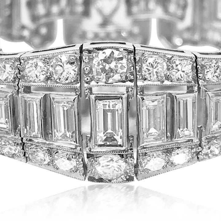 Close-up of a diamond ring with a detailed band