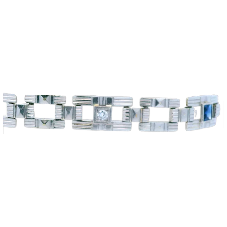 Silver bracelet with geometric design on a white background