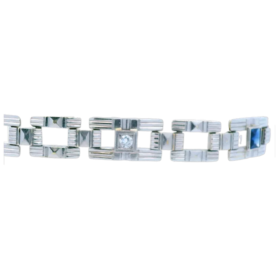 Silver bracelet with geometric design on a white background