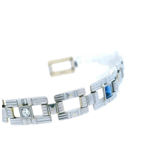 Silver bracelet with gemstones on a white background