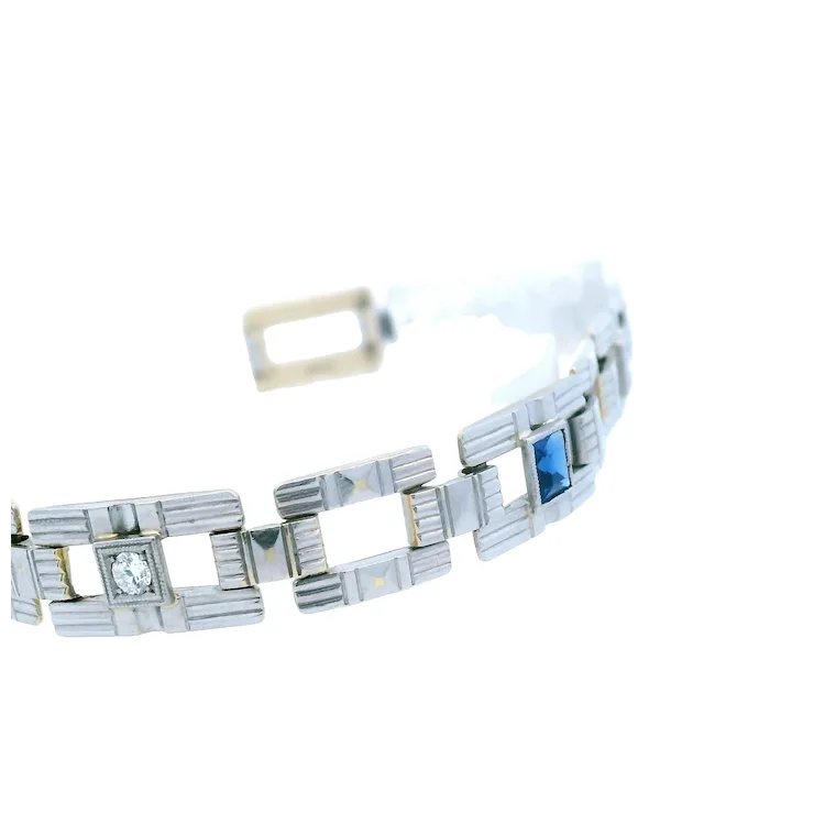 Silver bracelet with gemstones on a white background